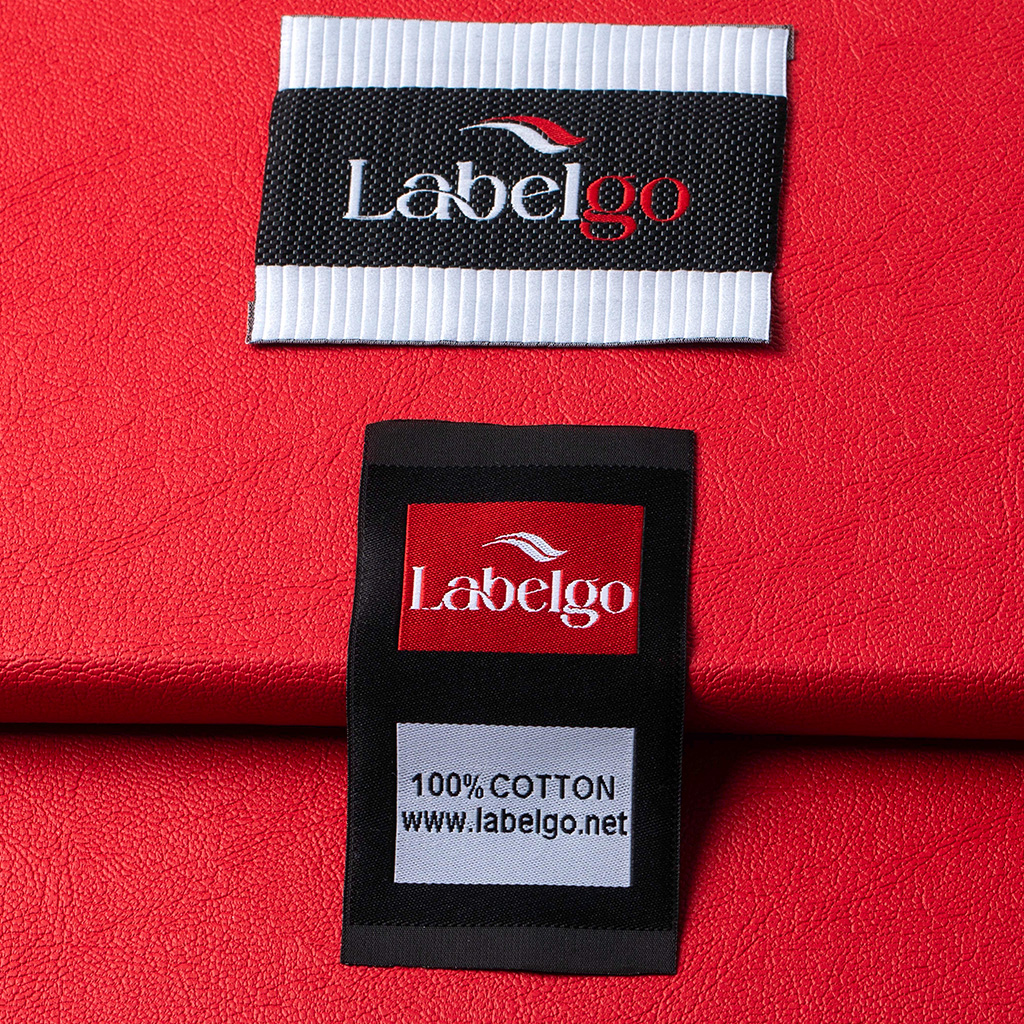 Close-up of a woven label with LabelGo logo on textile background.